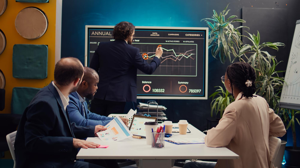 Small business owners reviewing financial projections and business growth plans